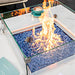 Elementi Plus Bianco White Marble Porcelain Square Fire Table on Patio with Blue Fire Glass 