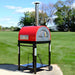 WPPO Traditional Red 25-Inch Dual Fueled Pizza Oven With Gas Attachment | Shown in Backyard