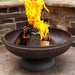Ohio Flame Patriot Fire Pit sitting on a brick patio with chairs arranged around it for a cozy gathering spot.