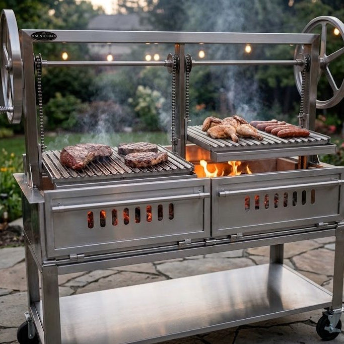 Sunterra stainless steel Santa Maria open fire grill with split crank grates searing tri-tip, ribeyes, chicken and sausages over a wood fire
