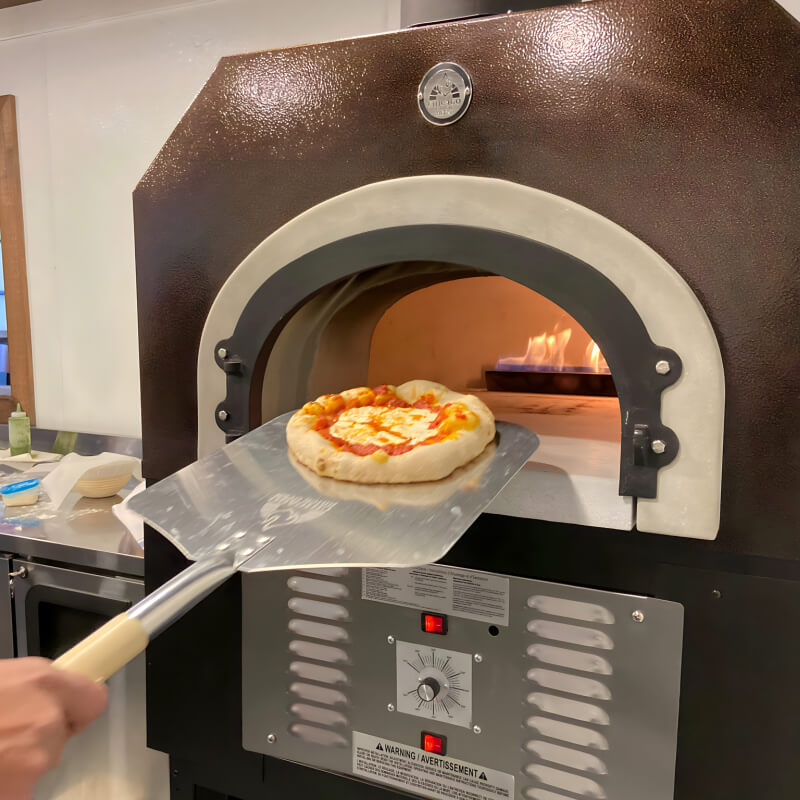 Chicago Brick Oven CBO-750 | Shown With Pizza Peel