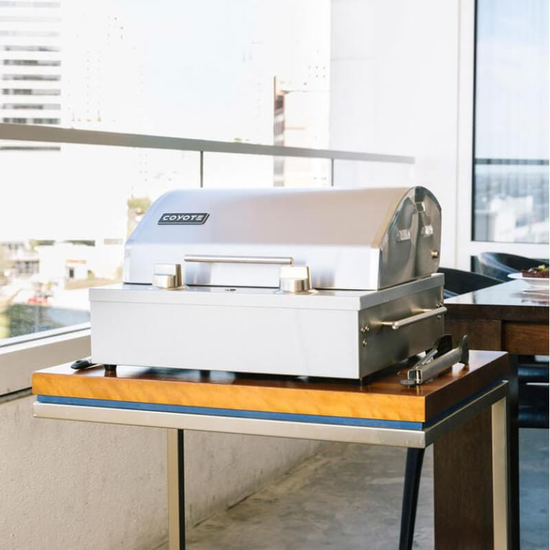 Coyote 18-Inch Portable Electric Grill | Shown Outdoors