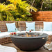 Elementi 42 Inch Lunar Concrete Fire Bowl In Dark Gray on Patio