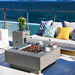 Elementi Manhattan Fire Pit Table on Patio in Light Gray