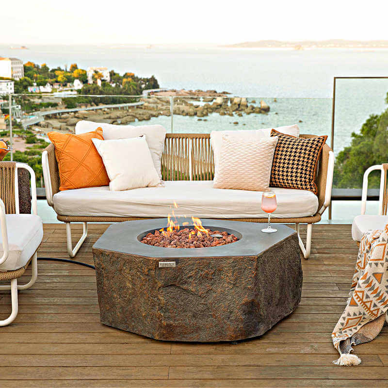 Elementi Columbia Hexagonal Concrete Fire Table on Patio with Flame
