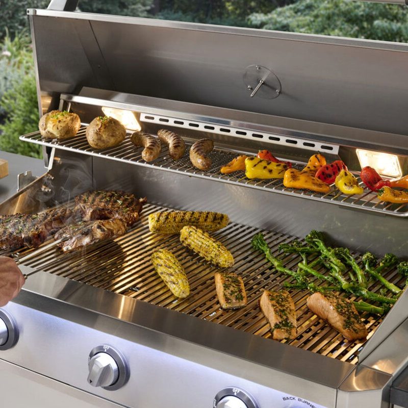 AOG L-Series Built-In Gas Grill Grilling Steaks and Corn on Warming Rack