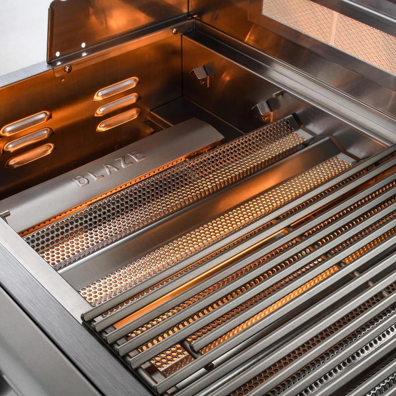 Blaze LTE+ grill burners glowing beneath 9mm triangular stainless steel cooking rods
