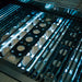Jupiter radiant ceramic briquette system installed beneath stainless steel cooking grates