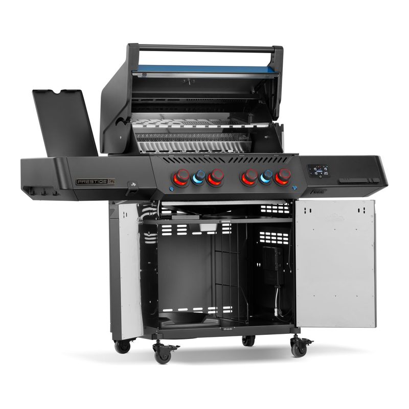 Napoleon Prestige Phantom 500 50th Anniversary Propane Grill with Burners Lit at Night