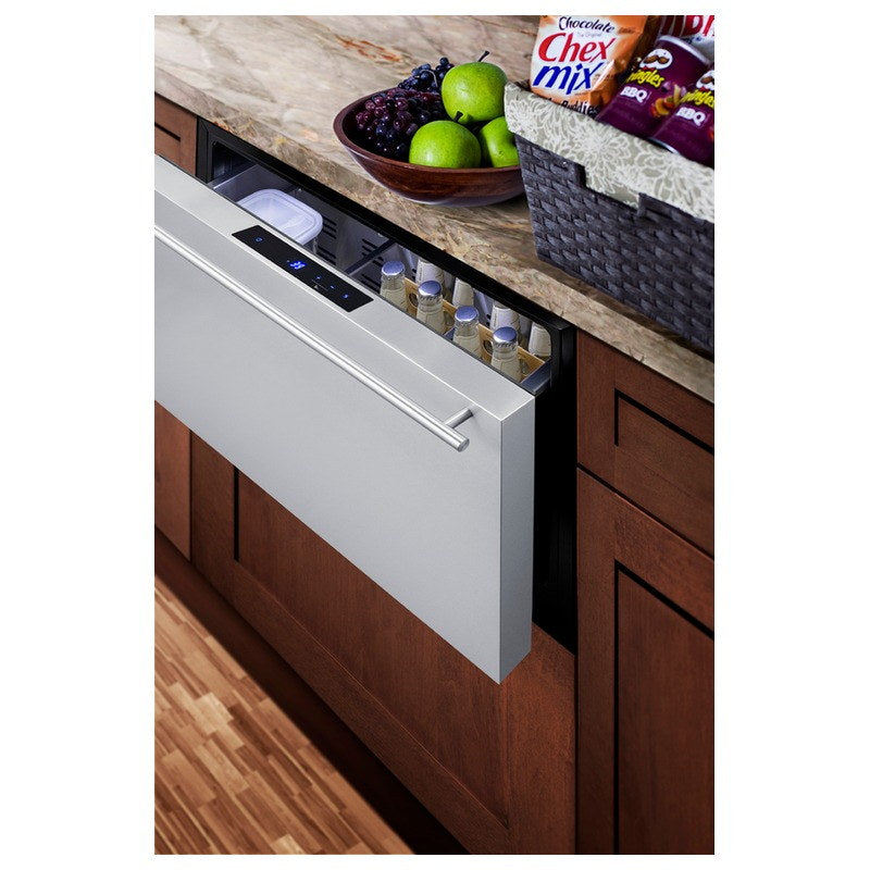 Summit FF1DSS drawer refrigerator built into wood cabinetry beneath a marble countertop