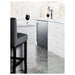 Summit BC74OSCOM 24-inch commercial outdoor single tap kegerator, built into a white brick bar counter, lifestyle view