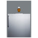 Summit SBC54OSBIADANK 24-inch ADA height outdoor kegerator, glass of beer on the flat cabinet top, detail view