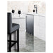 Summit SBC683OSTRIPLE 24-inch outdoor triple tap kegerator, built in under an outdoor bar counter, lifestyle view