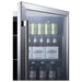 Summit SCR611GLOS 24-inch outdoor commercial glass-door beverage center, closeup of stocked cans and bottles through glass door