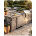 Summit SPR624OS 24-inch outdoor ADA all-refrigerator, installed in outdoor kitchen beside grill, lifestyle