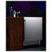 Summit SPR7BOSSTSR 24-inch outdoor all-stainless refrigerator with speed rail, installed in outdoor bar, door open, lifestyle view