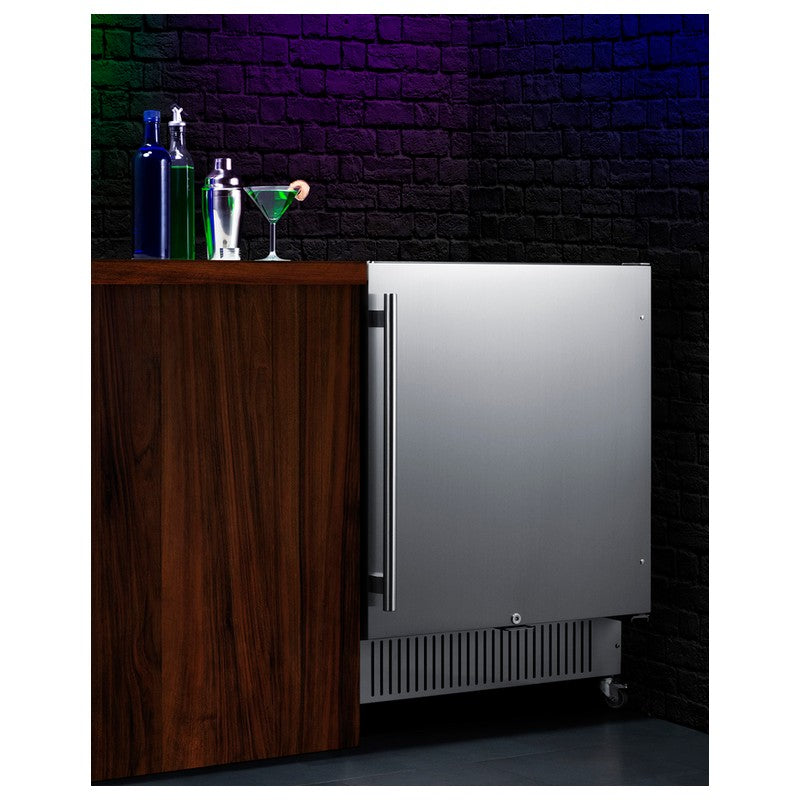 Summit SPR7BOSSTSR 24-inch outdoor all-stainless refrigerator with speed rail, installed in outdoor bar, door open, lifestyle view