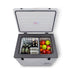 Summit SPRF56 26-inch portable 12/24V cooler, lid open, loaded with food and beverages
