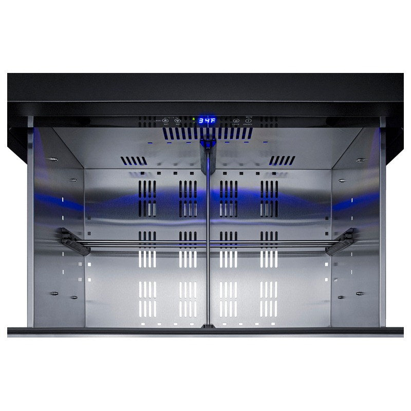 Open top drawer of the Summit SPR3032DCSSADA with blue LED lighting and dividers