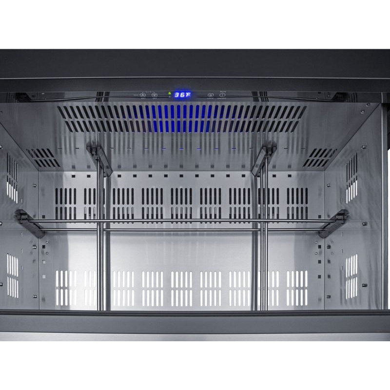 Open drawer of the Summit SPR36DROS outdoor refrigerator showing the stainless interior and blue LED lighting.
