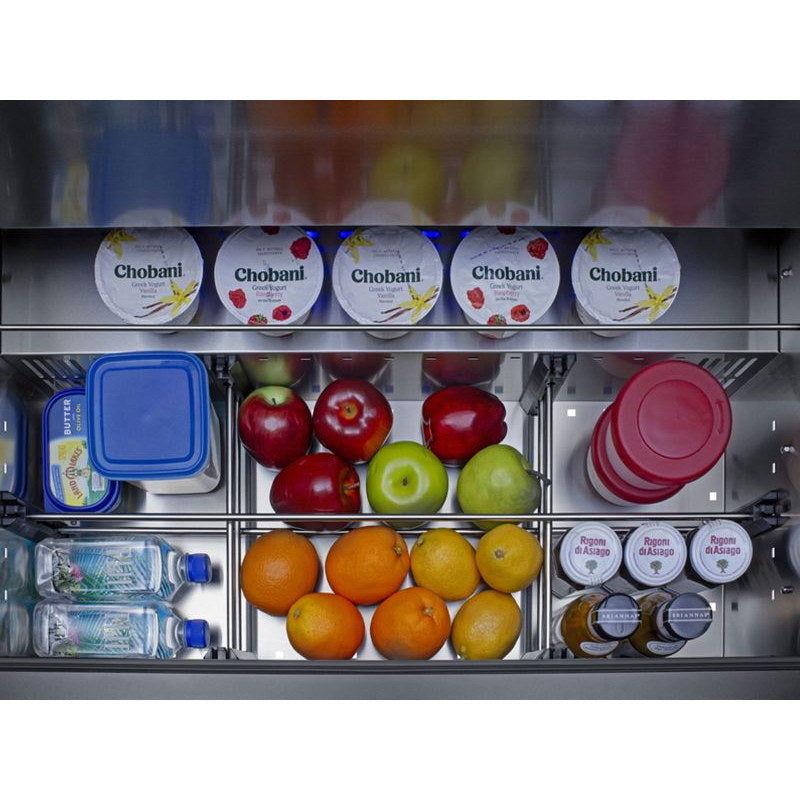 Overhead view into the open drawer of the Summit SPR36DROS outdoor refrigerator loaded with fresh food.