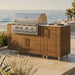 WeatherStrong 68 inch Horizon outdoor kitchen island Sanibel Teak on a coastal patio