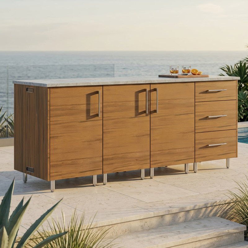 WeatherStrong 74 inch Lagoon outdoor kitchen island Miami Teak on a coastal patio