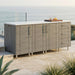 WeatherStrong 74 inch Lagoon outdoor kitchen island Sanibel Dark Ash on a coastal patio