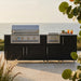 WeatherStrong 86 inch Sandbar island with side burner Sanibel Pitch Black on a coastal patio