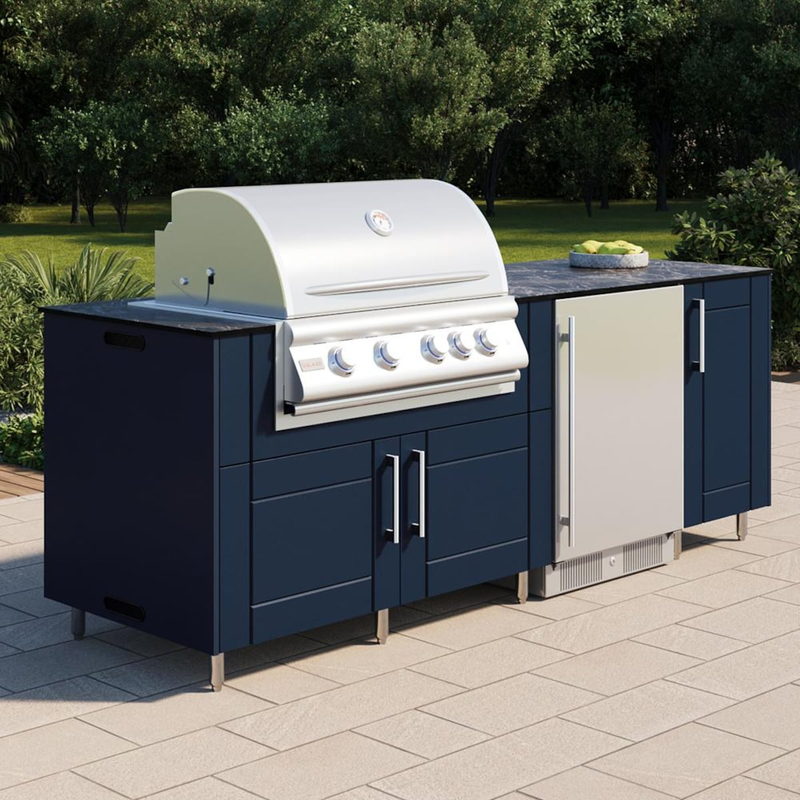 WeatherStrong Bimini Sapphire Blue outdoor kitchen island with Blaze grill and refrigerator in a backyard