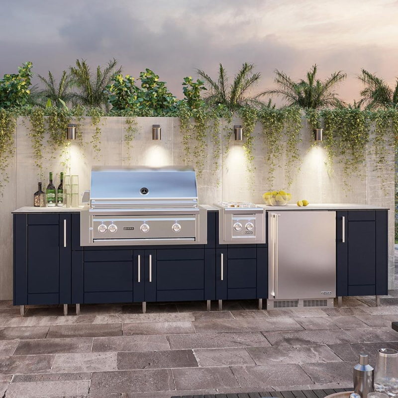 WeatherStrong Nassau Sapphire Blue outdoor kitchen island with Blaze grill, side burner and refrigerator on a patio