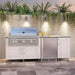 WeatherStrong Bimini Shell White outdoor kitchen island with Blaze grill and refrigerator on a patio