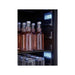 Close-up of the Zephyr Presrv beverage cooler black interior with chilled bottles and stemware lit by white LED panels.