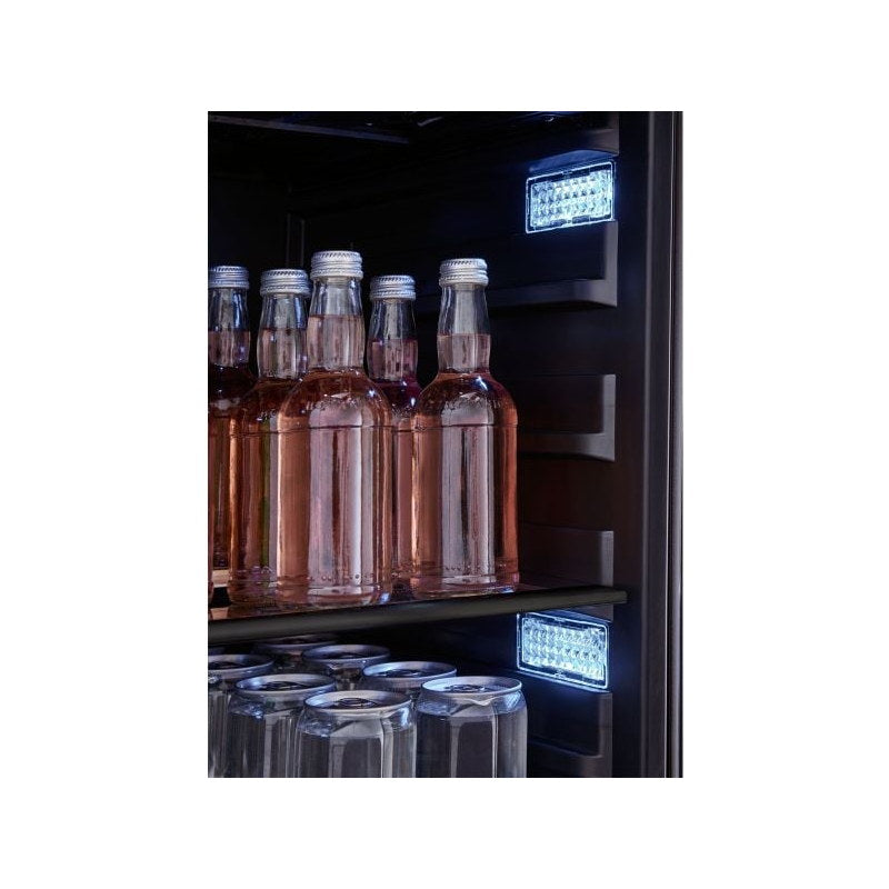 Close-up of the Zephyr Presrv beverage cooler black interior with chilled bottles and stemware lit by white LED panels.