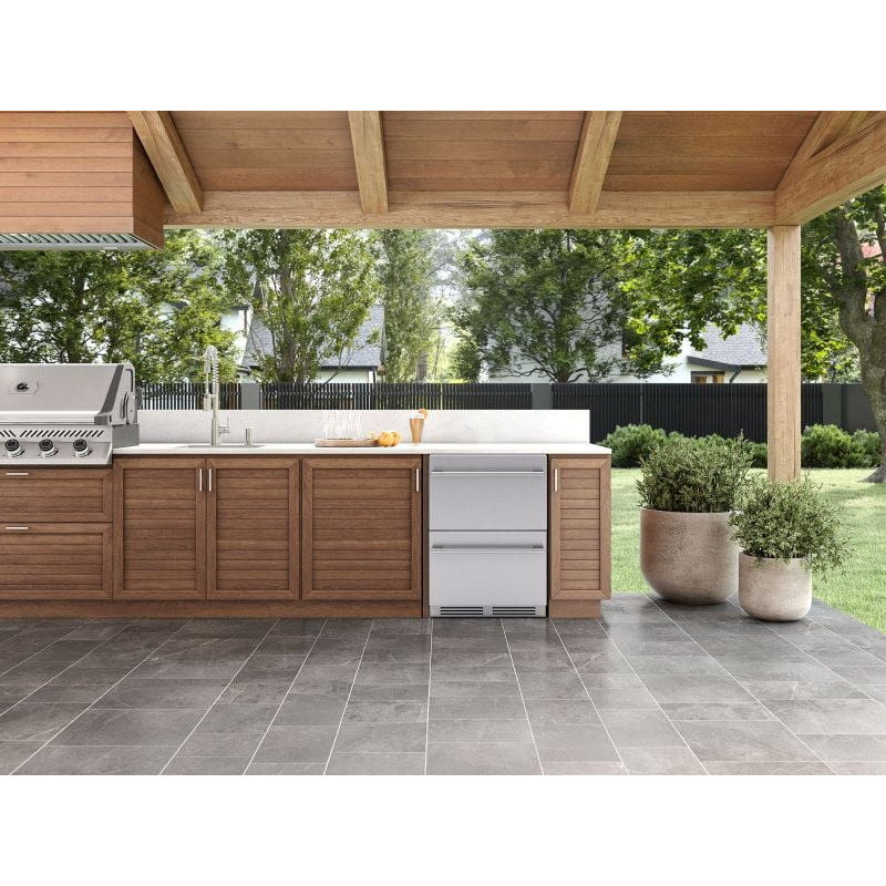 Zephyr Presrv dual drawer refrigerator built into a covered patio outdoor kitchen beside a built in gas grill.
