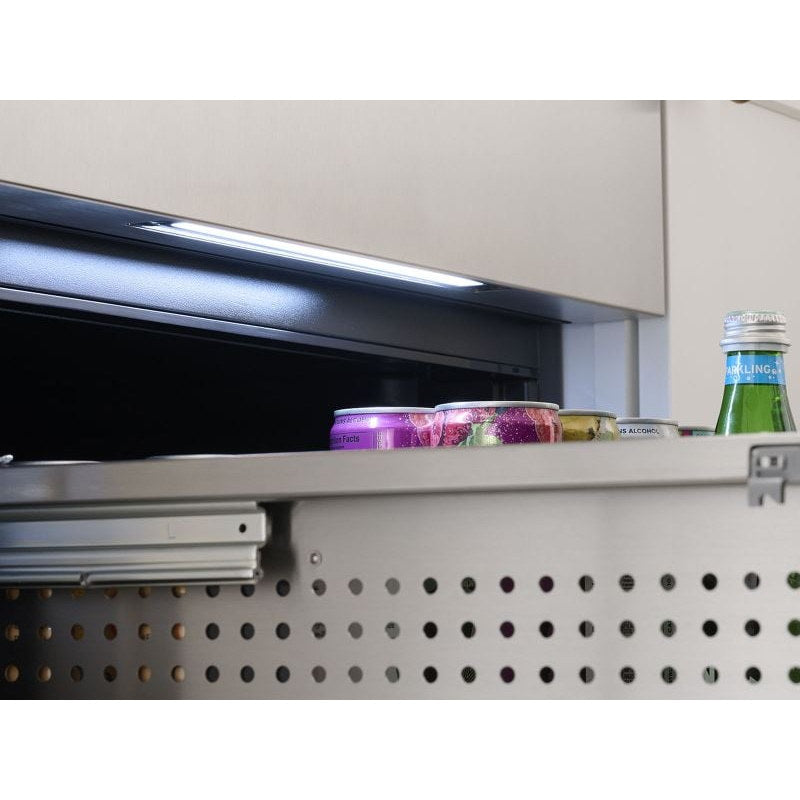 Zephyr Presrv dual drawer refrigerator interior LED strip set to Cloud White above jars and bottles on the drawer rail.