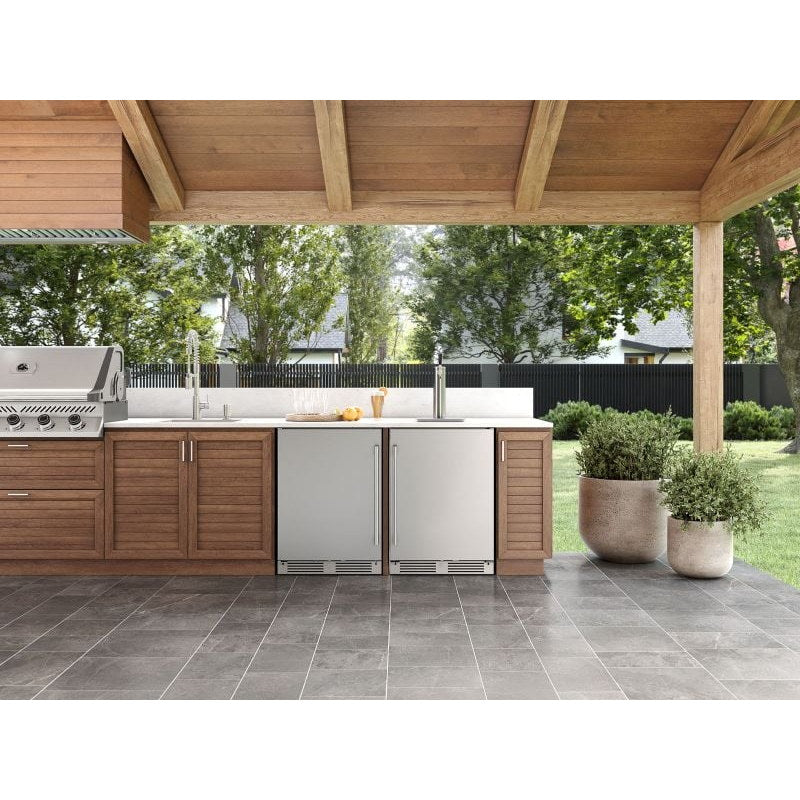 Zephyr Presrv outdoor kegerator in stainless steel installed in a covered patio outdoor kitchen beside a built in gas grill.