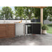 Zephyr Presrv outdoor kegerator built into a wood outdoor kitchen island with the door open showing the keg and bottle storage.