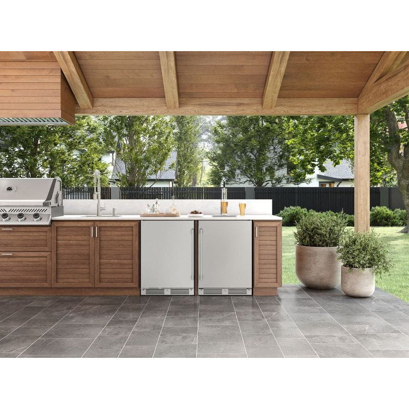Zephyr Presrv 24-inch outdoor refrigerators in stainless steel built into a covered patio outdoor kitchen.