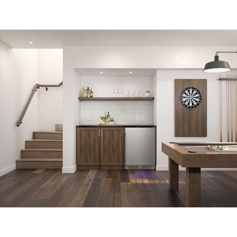 Zephyr Presrv 24-inch outdoor rated refrigerator in stainless steel installed under the counter of a home bar.