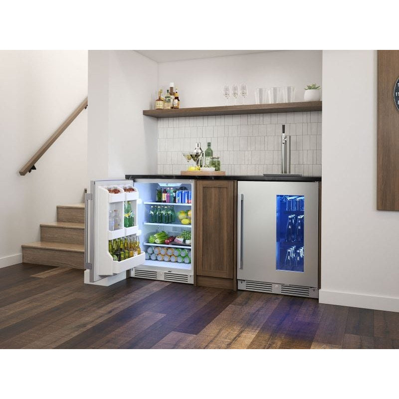 Zephyr Presrv 24-inch outdoor rated refrigerator installed in a basement bar with the door open beside a beverage cooler.