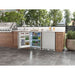 Zephyr Presrv 24-inch outdoor refrigerator built into an outdoor kitchen island with the door open and shelves stocked.
