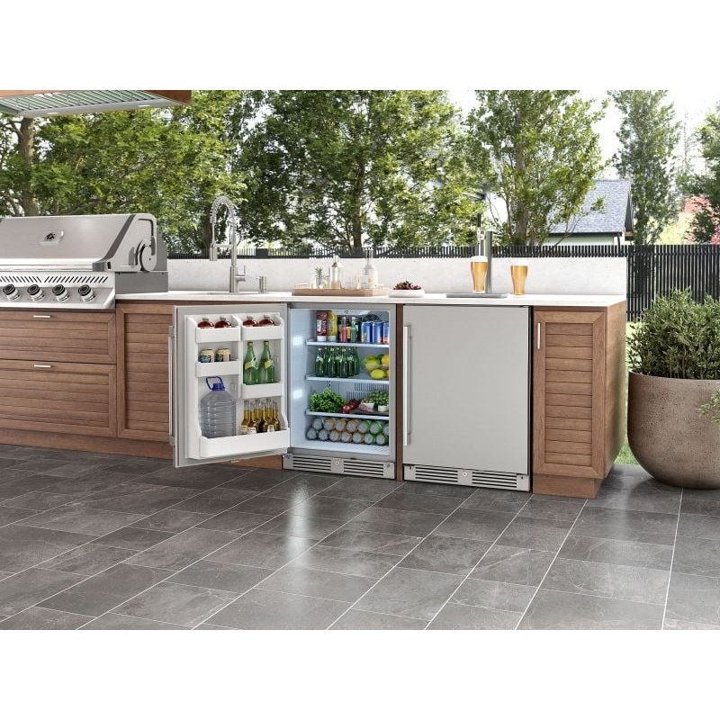 Zephyr Presrv 24-inch outdoor refrigerator built into an outdoor kitchen island with the door open and shelves stocked.