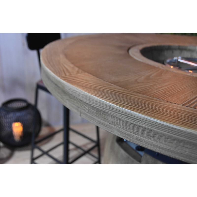 Barrel fire pit with lava rocks and flames
